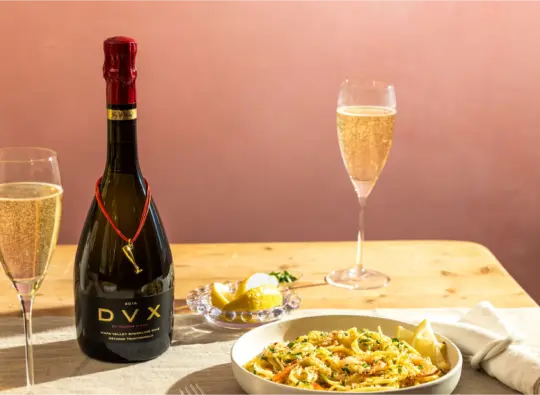 Shrimp scampi paired with Mumm Napa DVX sparkling wine