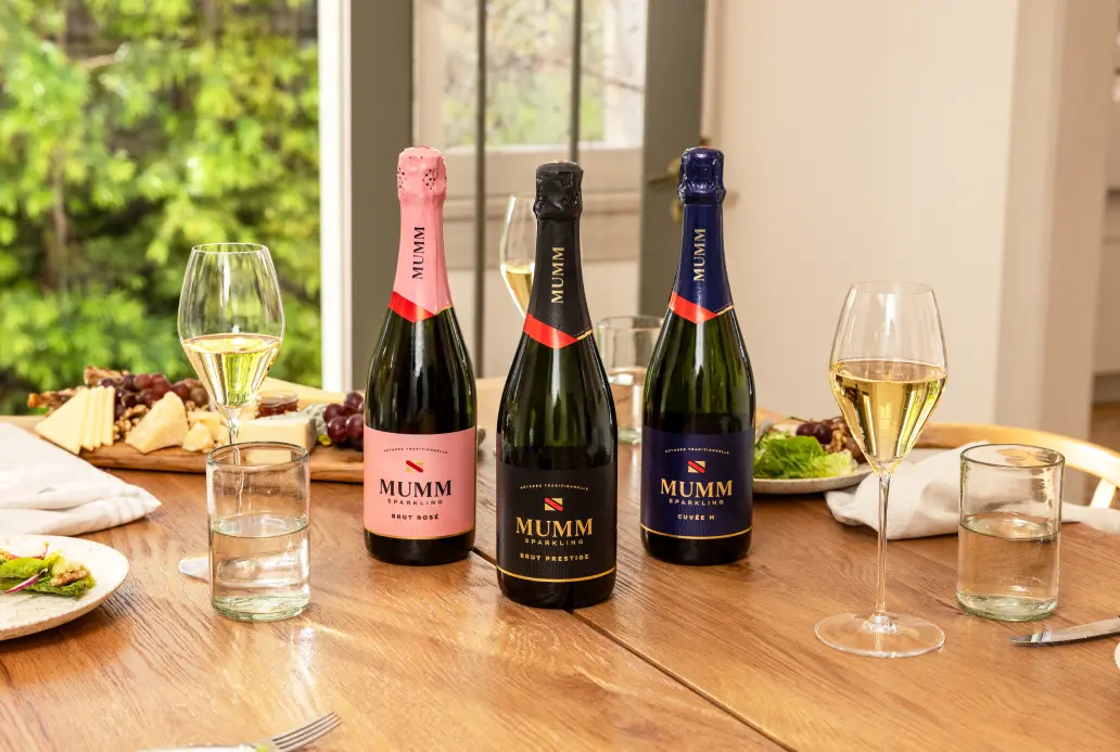 Mumm Sparkling Brut Prestige, Mumm Sparkling Cuvée M and Mumm Sparkling Rosé set on a table